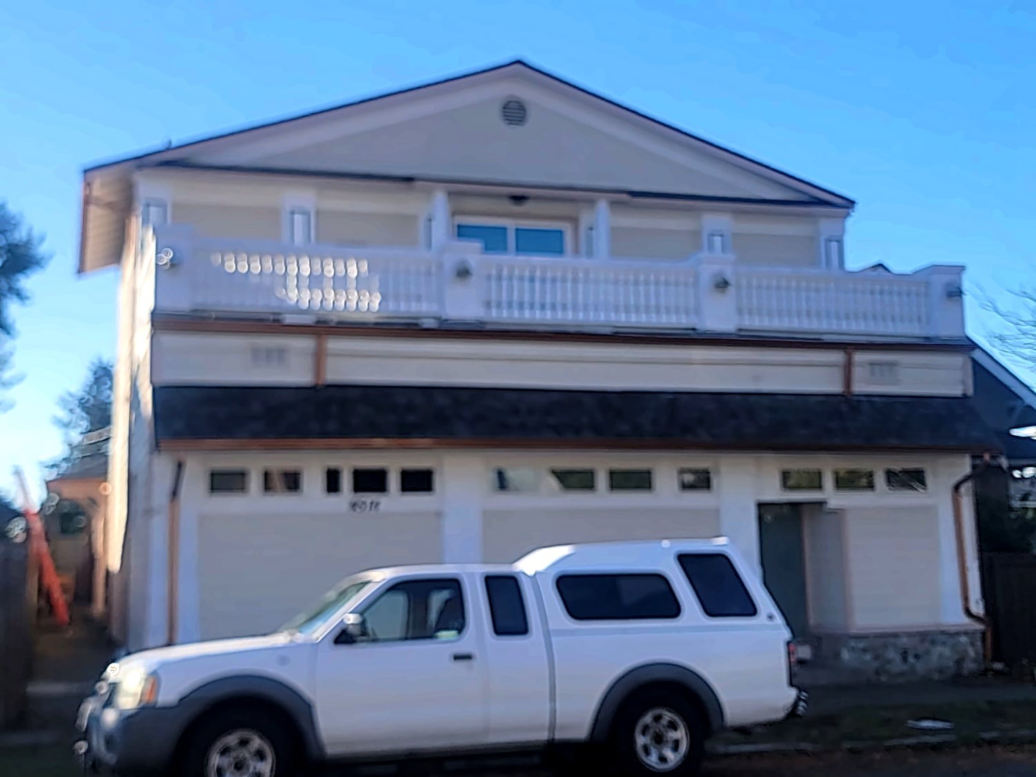 After: Three-car garage home with balcony